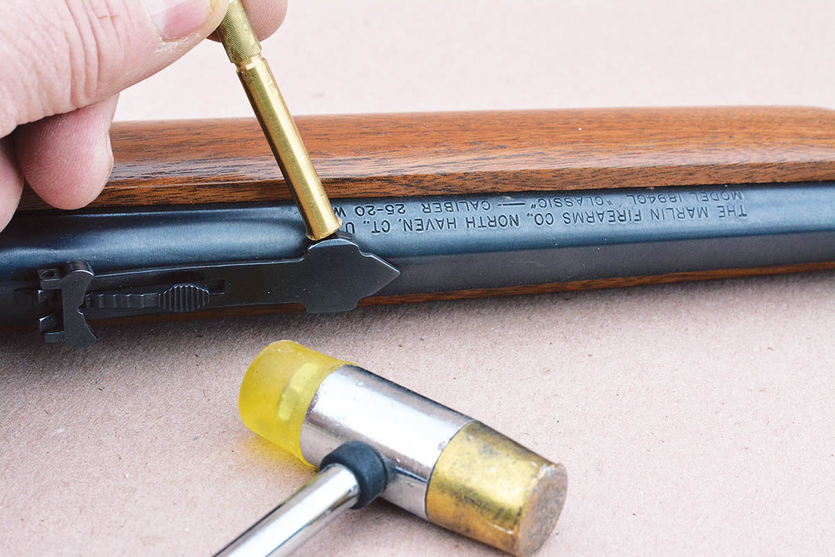 A brass punch is suggested to remove and reinstall dovetail-mounted sights.